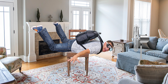 man skydiving in living room