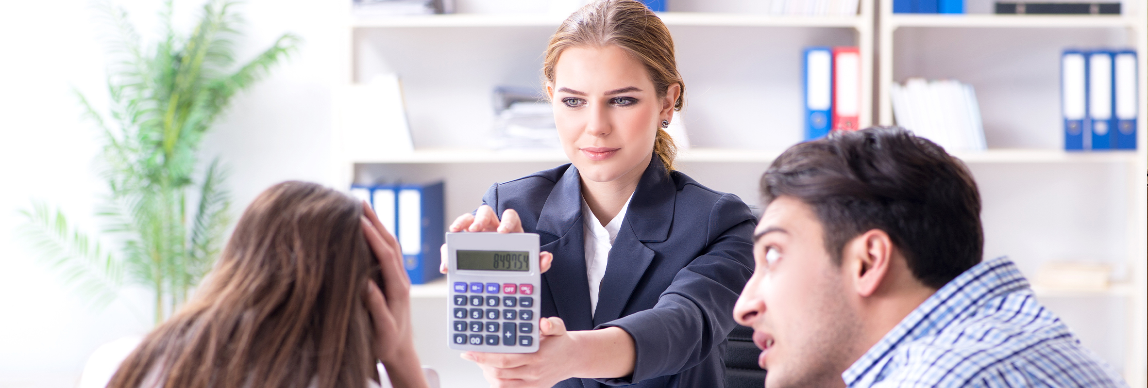 Couple sitting with financial advistor