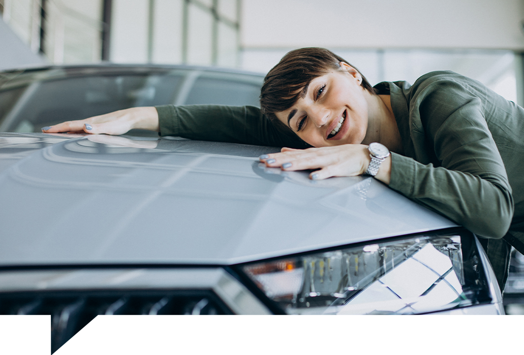 Girl hugging her first car