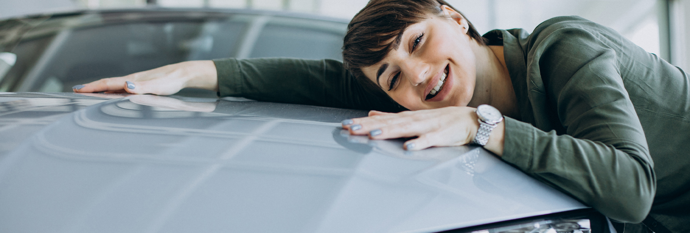 Girl hugging her first car