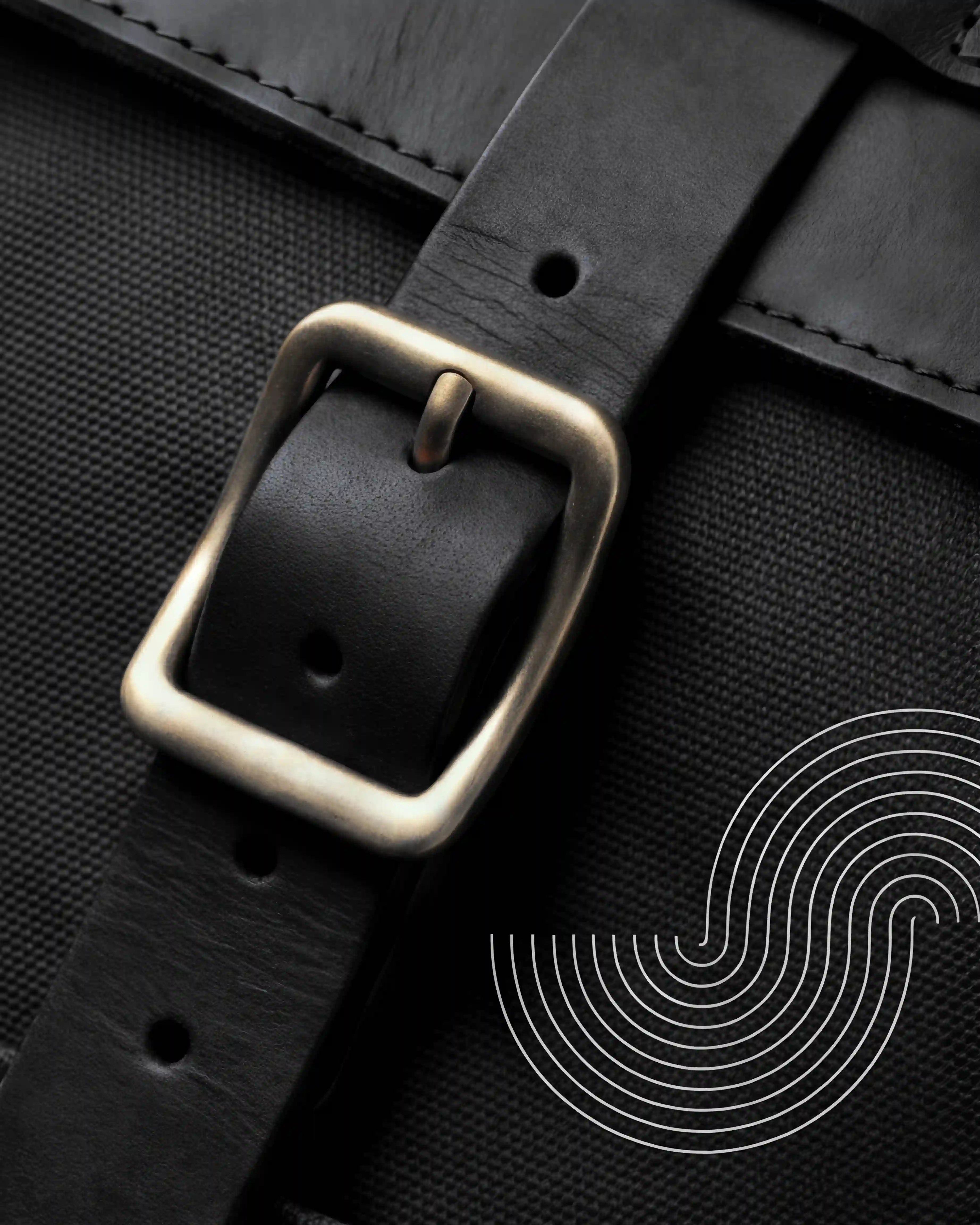 Close up of a leather black buckle on a backpack