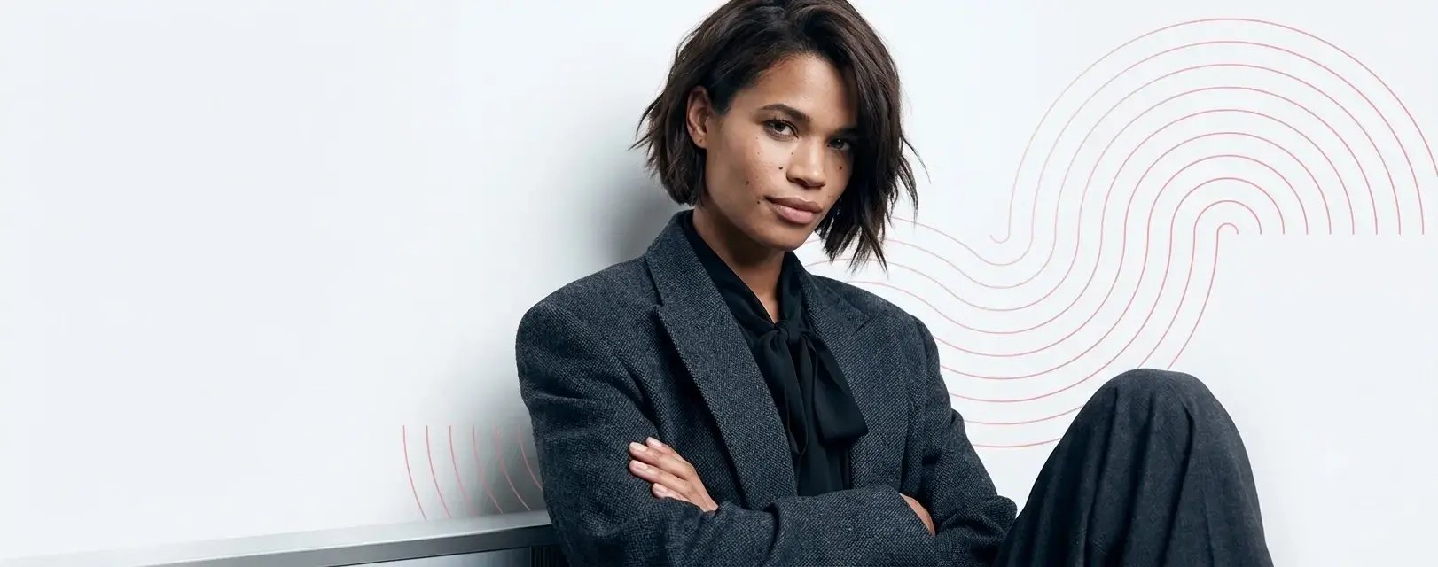 Woman-in-30s-in-black-business-suit