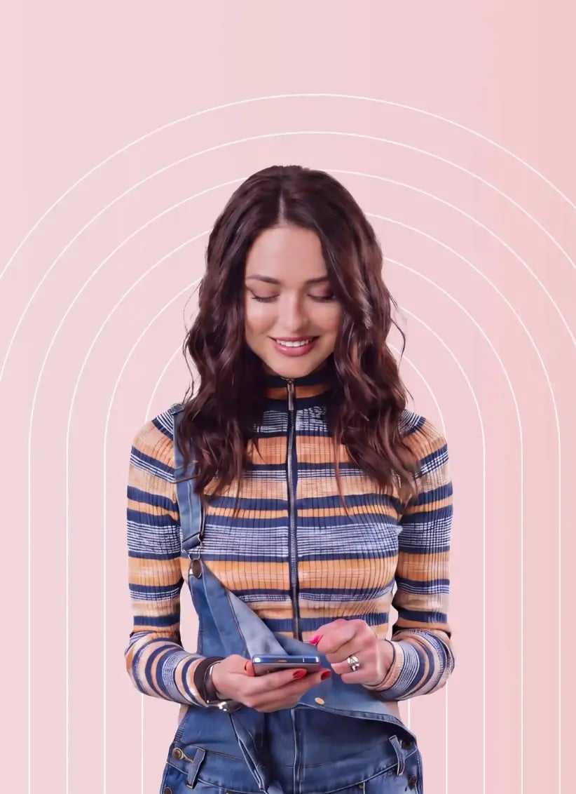 Woman-in-striped-sweater-looking-at-phone