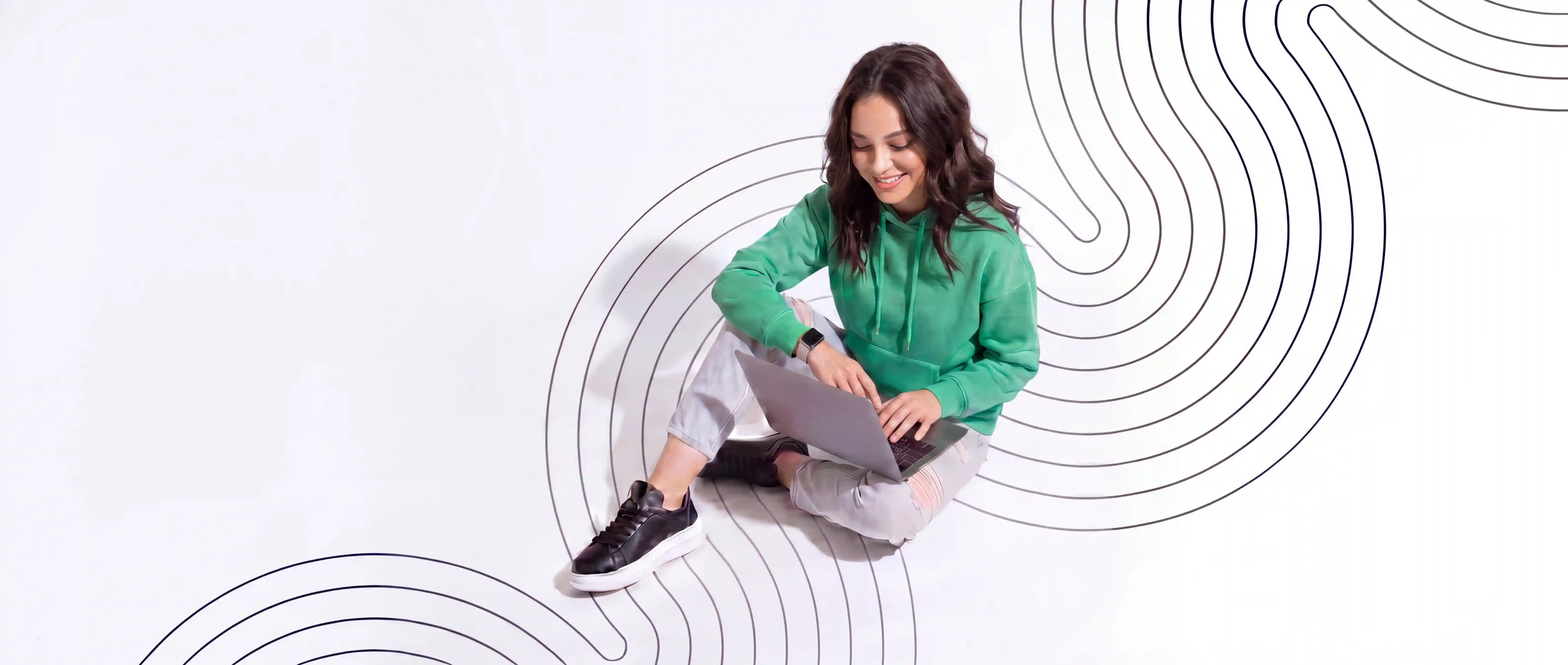 jenn-sitting-laptop-lines-white-landscape